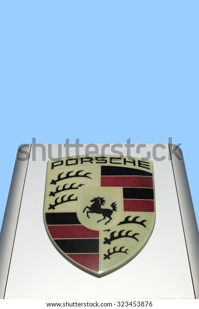 Aarhus, Denmark - September 10, 2015: Porsche\
logo on a panel. Porsche is a german automobile manufacturer\
specializing in high-performance sports\
cars