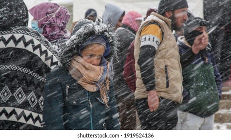 Aarsal, Beqaa Lebanon - 2 18 2021: Refugees In Refuge Camp In E'rsal Waiting For Donations Help At Syrian Lebanese Borders In Winter Snow Storm And Bad Weather Conditions