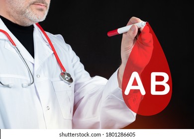 AB. Logo Of Fourth Blood Type On A Virtual Screen. Doctor Draws A Lifeblood Logo. Doctor On A Black Background. Determination Of Rhesus Factor Lifeblood. Blood Type AB. Red Blood Cell Analysis