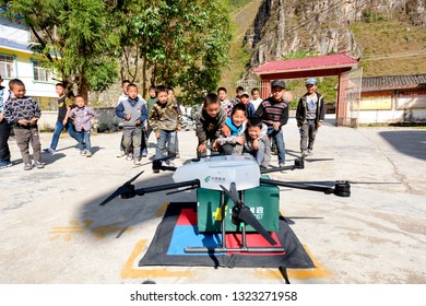 Aba, Sichuan / China - September 20 2018: China Post Has Tested Its Drone Delivery Project In Sichuan Rural Area, Where It Is Warmly Welcomed By A Group Of Kids Under Poverty Line. 