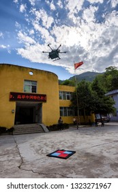 Aba, Sichuan / China - September 20 2018: China Post Has Tested Its Drone Delivery Project In Sichuan Rural Area, Where It Is Warmly Welcomed By A Group Of Kids Under Poverty Line. 