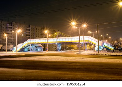 Abakan, Russia, 12.22.2019: Overhead Pedestrian Crossing, Passing Above The Highway. Night. Winter