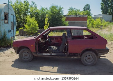 Abandon Old Red Car On The Junkyard