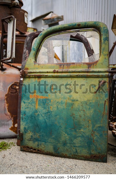 abandon place of rusted car door machine secret\
metal broken dream space back yard garden junk yard retro vintage\
style scrap abandon\
place