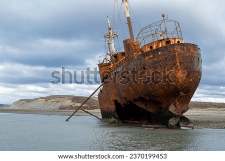 Abandoned aground commercial ship at cabo san pablo beach, tierra del fuego, argentina