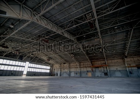 Abandoned airplane hangar with large trusses