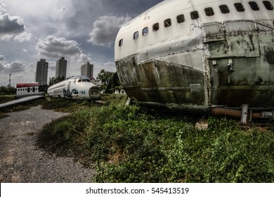 Abandoned Airplane, Old Crashed Aircraft, Plane Wreck In Graveyard With Blue Cloudy Sky
