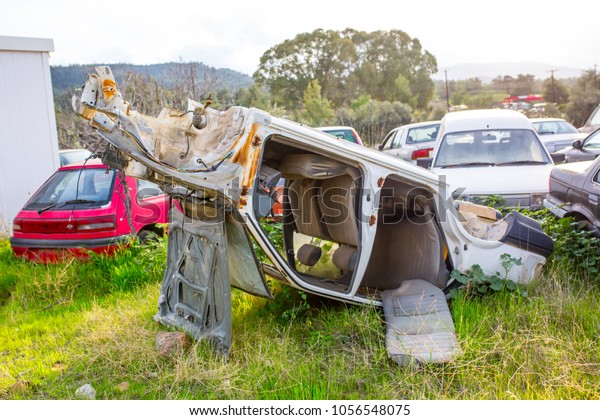 Abandoned auto cars, old rusty spoiled car dump\
decimated cars after an\
accident