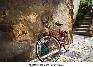 Abandoned Bike On The Italian Street In The Old Tuscany