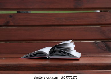 Abandoned Book In The Park On A Bench