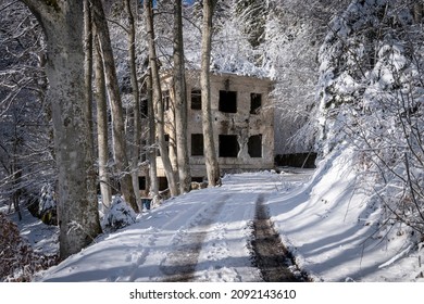 Abandoned Brestovac hospital, high on the Medvednica mountain, lying forsaken in snow covered forest - Shutterstock ID 2092143610