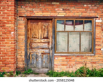 abandoned brick building, shabby old door closed, window curtained with faded fabric, vintage look, urban landscape - Powered by Shutterstock