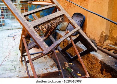 Abandoned Broken Chairs In A Sun Light 