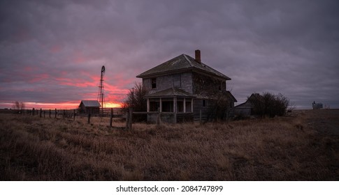 Abandoned and broken down old farms and homesteads with dark and ominous skies in Alberta, Canada - Shutterstock ID 2084747899