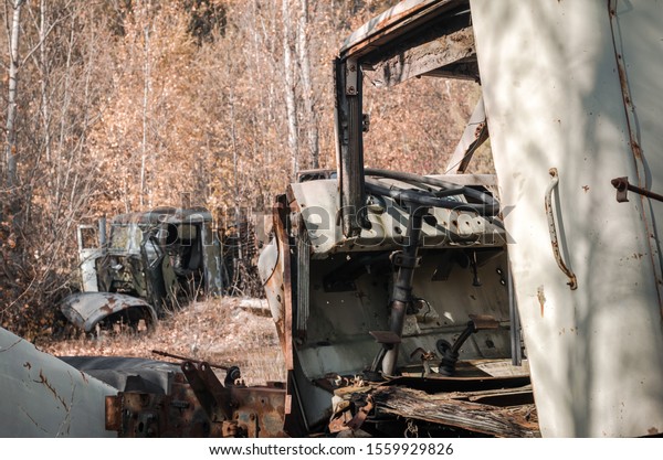 abandoned broken equipment car in the Chernobyl
forest Ukraine in
autumn
