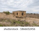 An abandoned building with traces of bullets has stood since the Yom Kippur War in the Golan Heights in northern Israel