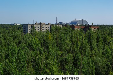 Abandoned Buildings And Sarcophagus Above The Reactor In Ghost Town Pripyat Chornobyl Zone