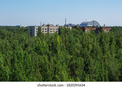 Abandoned Buildings And Sarcophagus Above The Reactor In Ghost Town Pripyat Chornobyl Zone, Radiation, Nuclear Catastrofe