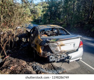 Abandoned Burnt Out Car At The Road Side Rear End Image