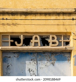 Abandoned Business Warehouse With Lettering, Located In Olhao, Portugal.