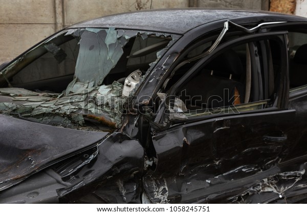 Abandoned car after the\
accident. A broken auto, head-on collision, a deformed body.\
Consequences of an automobile accident. Broken airbag, cracks\
windshield