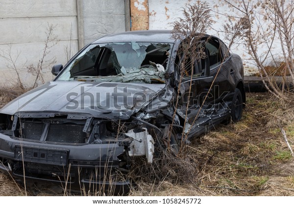 Abandoned car after the\
accident. A broken auto, head-on collision, a deformed body.\
Consequences of an automobile accident. Broken airbag, cracks\
windshield