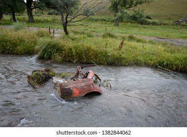Abandoned car body in a mountain river Yarovka in the village of Generalka of the Altai Territory