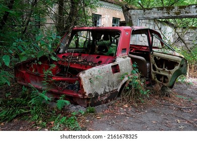 abandoned car in the Chernobyl Nuclear Power Plant Zone of Alienation                               