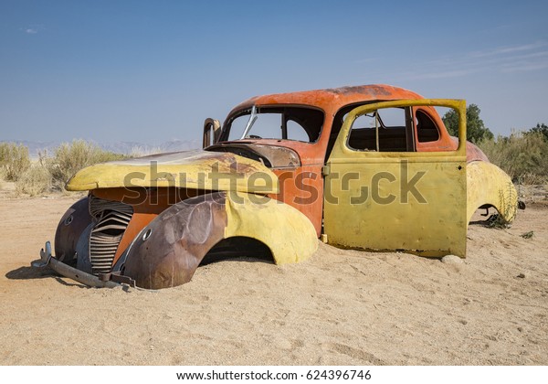 Abandoned car in the\
desert