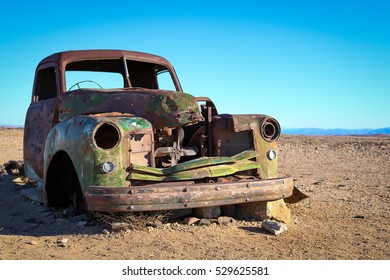 Abandoned Car In The Namibian Desert.