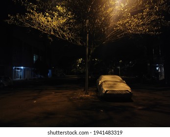 Abandoned Car On The Street At Night