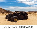 An Abandoned car that was shot down in a Diamond Heist in 1934 within Aus Vista, Namibia, Africa