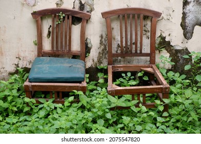 An Abandoned Chair Sat In The Yard