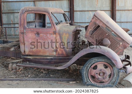 Abandoned Classic Pick Up Truck Rusting in a Barn with Flat Tires Model T, Ford, on a Condemned Ranch in California