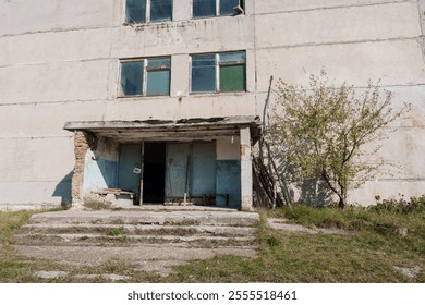 Abandoned Concrete Structure Overgrown with Vegetation. - Powered by Shutterstock