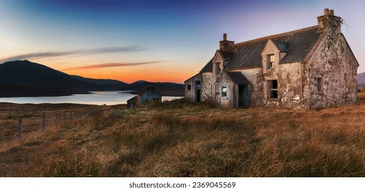 An abandoned cottage at Airidh a Bhruaich on the shores of Loch Seaforth on the Isle of Lewis in the Outer Hebrides of Scotland - Powered by Shutterstock