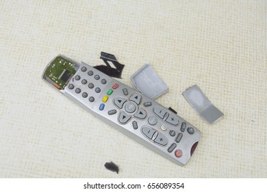 Abandoned Crashed TV Remote Control On A Table Top, Overhead View