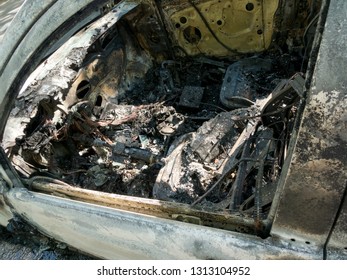 Abandoned damaged and burnt out car