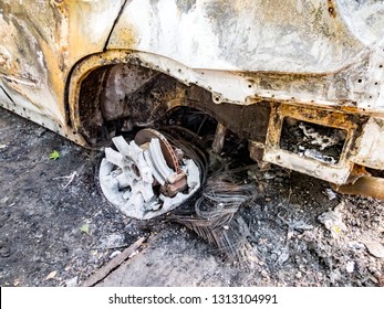 Abandoned damaged and burnt out car