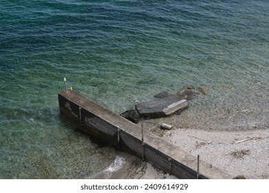 an abandoned dock on the lake Maggiore  - Powered by Shutterstock