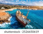 Abandoned Edro III Shipwreck at seashore of Peyia, near Paphos, Cyprus. Historic Edro III Shipwreck site on the shore of the water in Cyprus. Aerial view of Shipwreck EDRO III, Pegeia, Paphos.