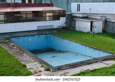 Abandoned Empty Swimming Pool In A Backyard