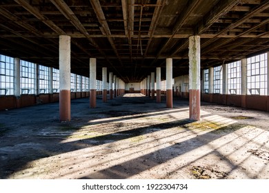 Abandoned factory with large windows.