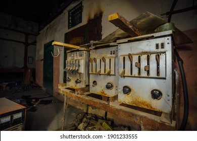 Abandoned Factory At Night. Old Rusty Machinery.