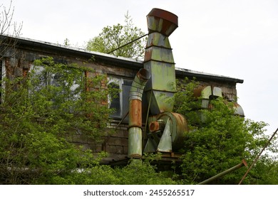 Abandoned factory that nature is now reclaiming - Powered by Shutterstock