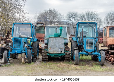 Abandoned Farm Equipment. Old Tractors Are Rusty And Broken.