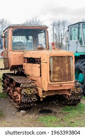 Abandoned Farm Equipment. Old Tractors Are Rusty And Broken.