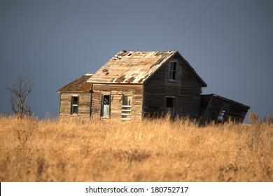 Abandoned Farm House On The Prairie