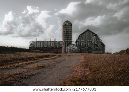 abandoned farmhouse farm barn wisconsin USA dirt road orange dead grass bright sky clouds