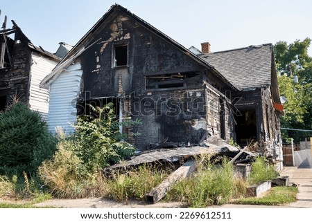 Abandoned fire damaged house in Detroit, Michigan, focus on building